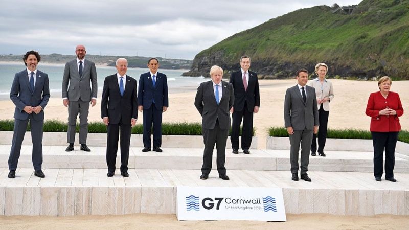 World leaders gather on the beach in Carbis Bay for a photo on Friday, the first day of the summit-4ada6f7bac46eac891036ab56d5504bd1623556691.jpg